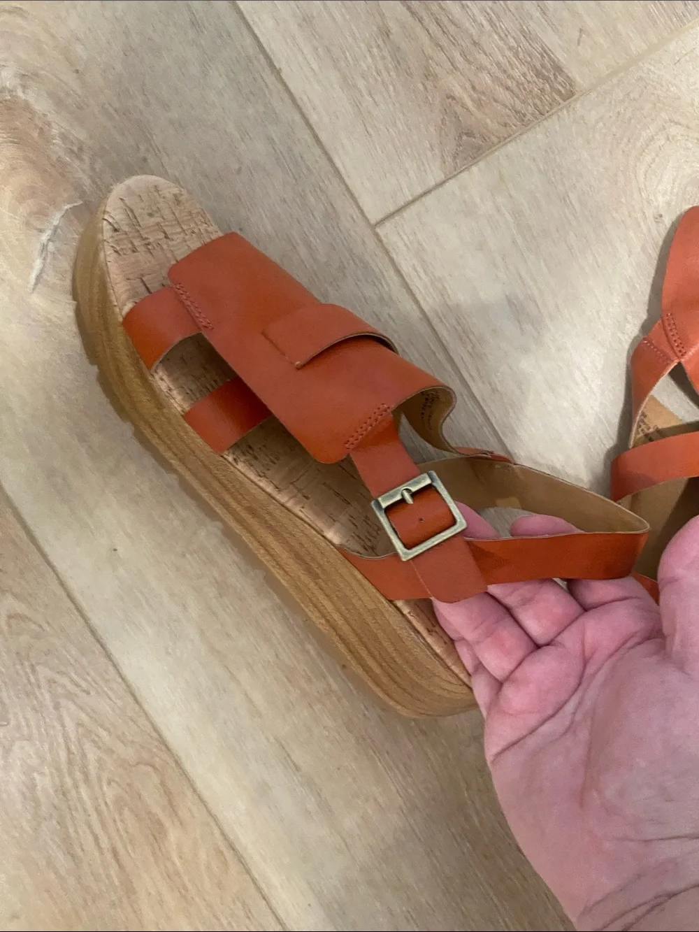 Women’s Korks platform wedge sandals feature a cork sole slingback buckle.